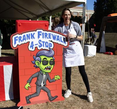 Security Operations Center manager Emily Longman poses with Frank Firewall.