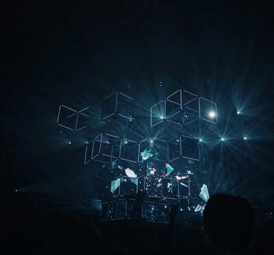 Neon blue cube outlines against a dark blue background.