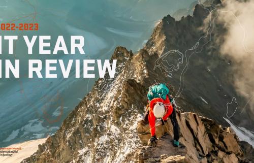 Climber on a mountain with text: 2022-2023 IT Year in Review