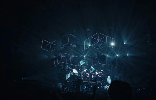 Neon blue cube outlines against a dark blue background.