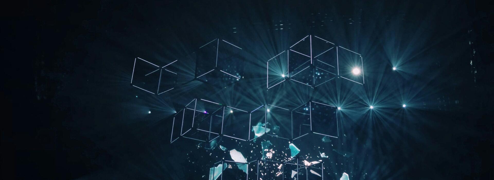 Neon blue cube outlines against a dark blue background.
